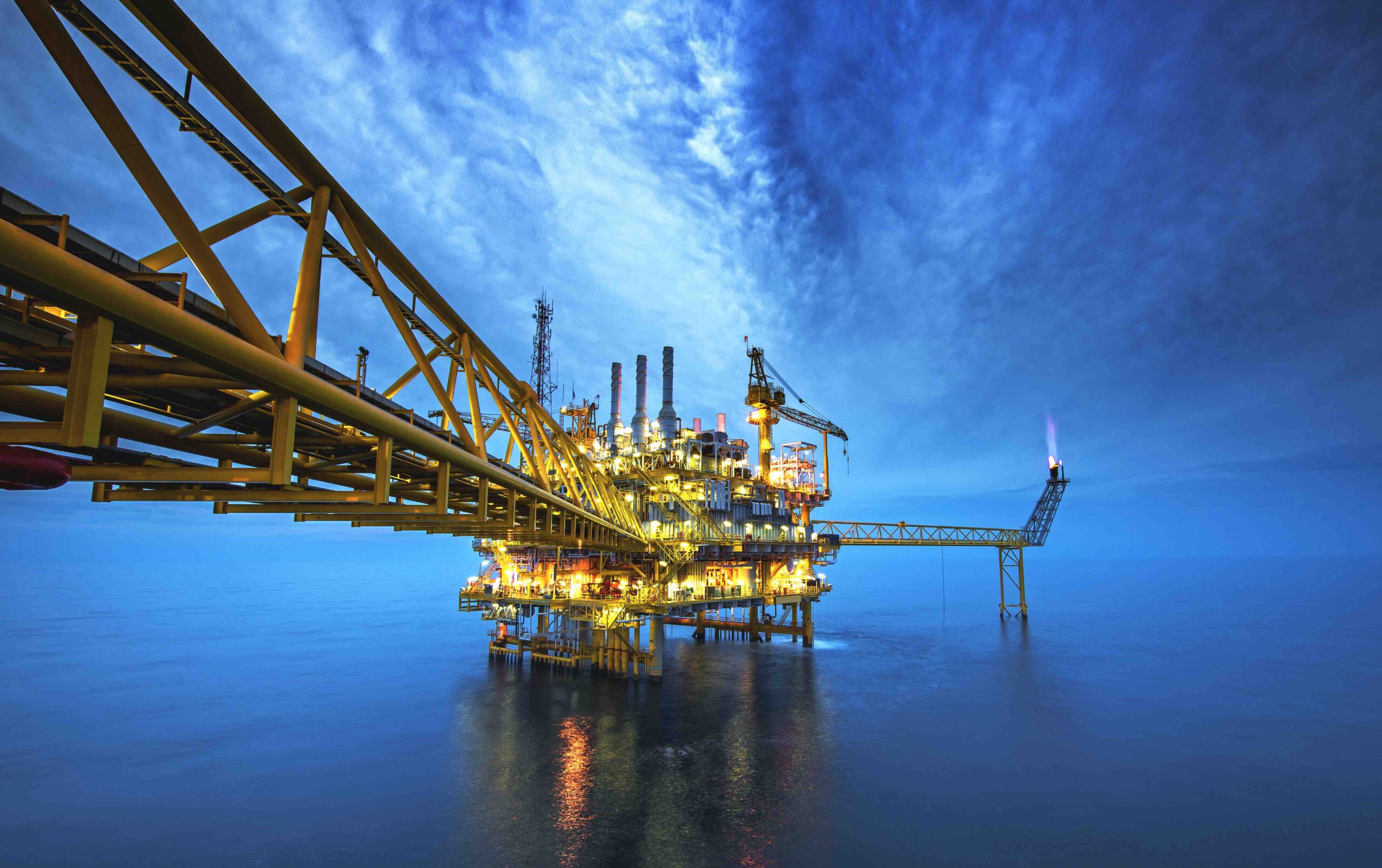 Offshore oil and gas rig platform with beautiful sky in the gulf of Thailand.